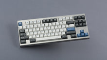 Load image into Gallery viewer, GMK CYL Arctic on silver keyboard