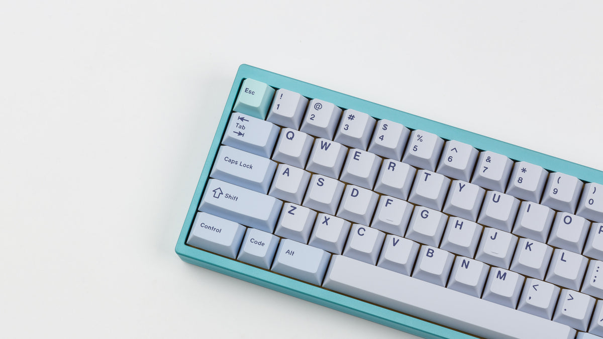  GMK CYL Astral Light on a blue keyboard close up left side angled 