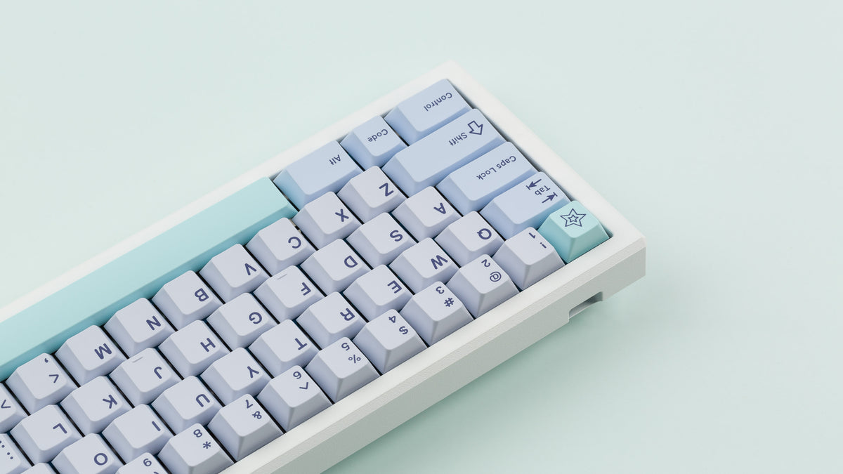  GMK CYL Astral Light on a white keyboard close up on the left side angled 