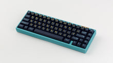 Load image into Gallery viewer, GMK CYL Awaken on a blue keyboard angled
