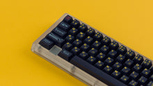 Load image into Gallery viewer, GMK CYL Awaken on a clear keyboard zoomed in on left