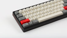 Load image into Gallery viewer, GMK CYL Beta JS on a black keyboard close up on left side