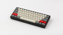 Load image into Gallery viewer, GMK CYL Beta JS on a black keyboard angled