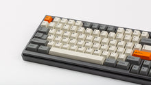 Load image into Gallery viewer, GMK CYL Beta on a grey keyboard close up on left side