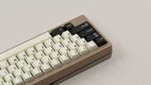 Load image into Gallery viewer, GMK CYL Black Snail on a beige keyboard zoomed in on left back view