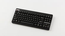 Load image into Gallery viewer, GMK CYL Black Snail on a black Classic TKL angled