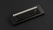 Load image into Gallery viewer, GMK CYL Black Snail on a black keyboard