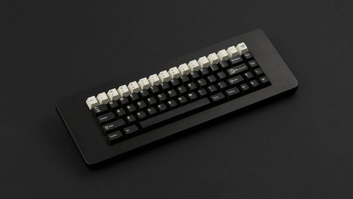  GMK CYL Black Snail on a black keyboard 