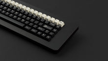 Load image into Gallery viewer, GMK CYL Black Snail on a black keyboard zoomed in on right