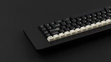 Load image into Gallery viewer, GMK CYL Black Snail on a black keyboard back view zoomed in on right