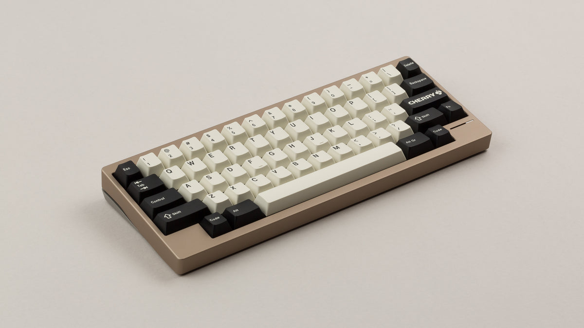  GMK CYL Black Snail on a beige keyboard 
