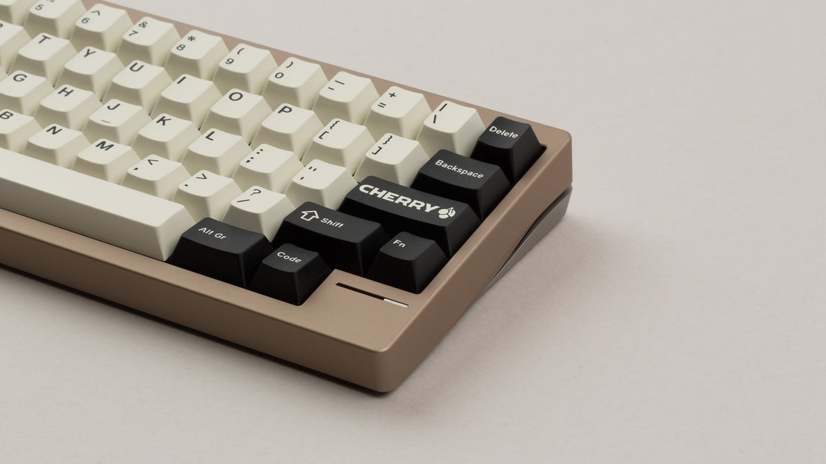  GMK CYL Black Snail on a beige keyboard zoomed in on right 