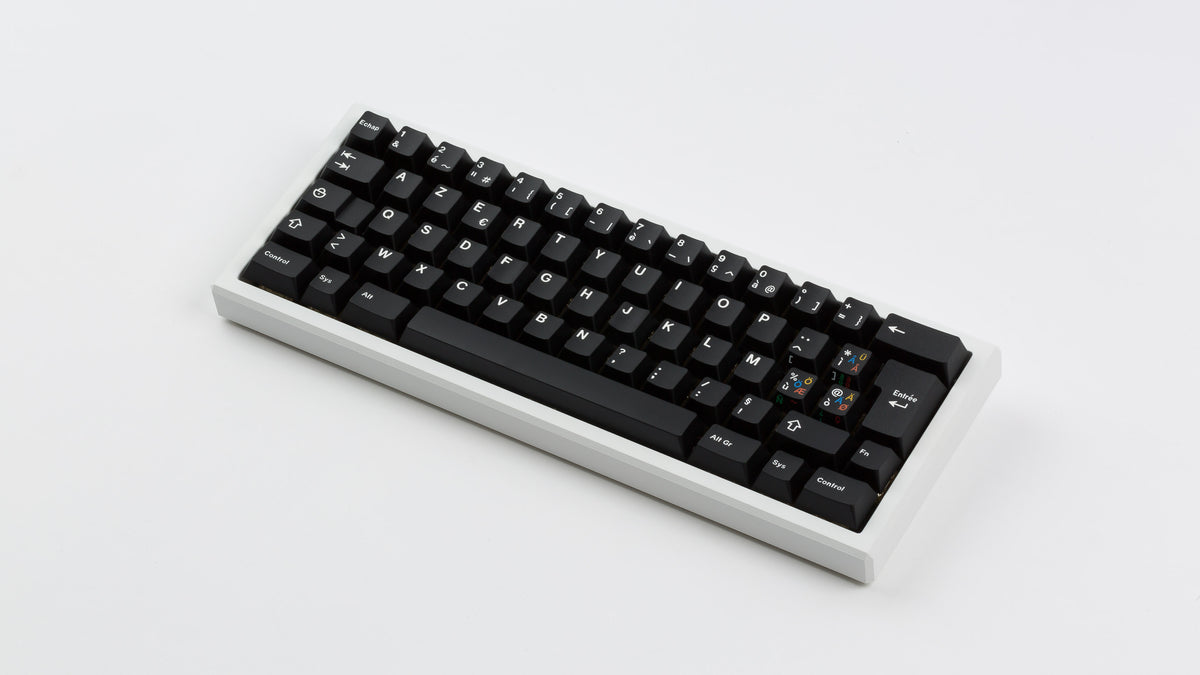  GMK CYL Blanc Sur Noir on white keyboard angled 