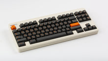 Load image into Gallery viewer, GMK CYL Carbon R3 on a Beige CLASSIC-TKL angled