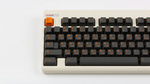 Load image into Gallery viewer, GMK CYL Carbon R3 on a Beige CLASSIC-TKL close up on left side