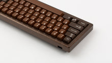 Load image into Gallery viewer, GMK CYL Chocolatier keycaps on dark brown hammered-texture keyboard, close-up of right side from rear angle