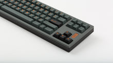 Load image into Gallery viewer, GMK CYL Cinder on grey keyboard zoomed in on right