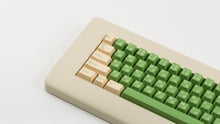 Load image into Gallery viewer, GMK CYL Cream matcha on beige NK87 GMK CYL Cream matcha on beige keyboard zoomed in on left
