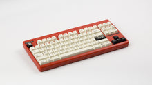 Load image into Gallery viewer, GMK CYL Creme on an ironstone Classic TKL keyboard angled