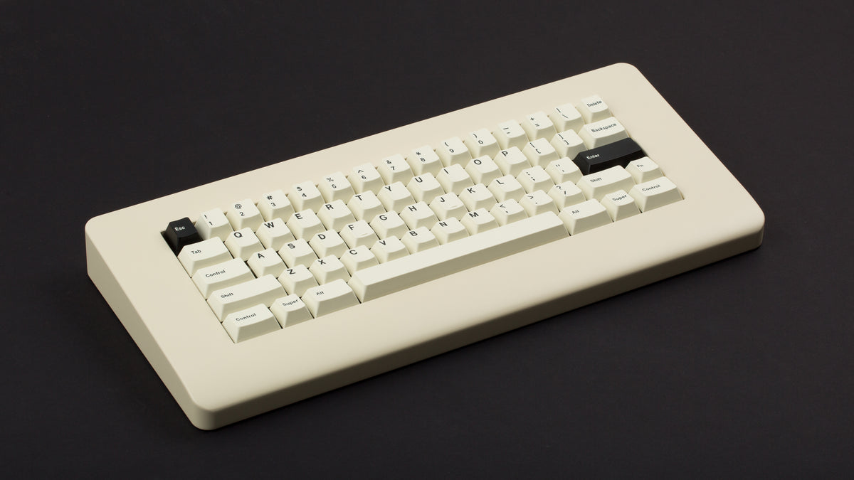  GMK CYL Creme on a beige keyboard angled 