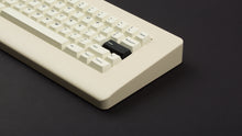 Load image into Gallery viewer, GMK CYL Creme on a beige keyboard close up on right side angled