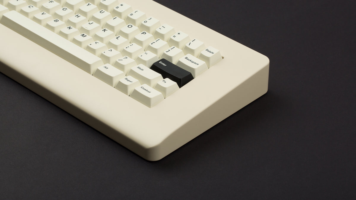  GMK CYL Creme on a beige keyboard close up on right side angled 