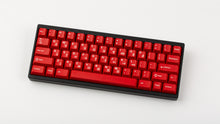 Load image into Gallery viewer, GMK CYL Crimson Cadet on a black and red keyboard top down