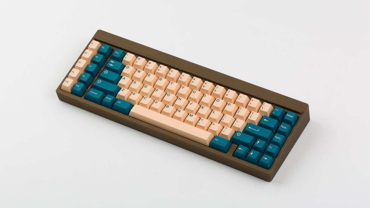 GMK Earth Tones on a brown keyboard angled 