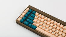 Load image into Gallery viewer, GMK Earth Tones on a brown keyboard zoomed in left