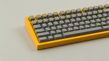 Load image into Gallery viewer, GMK CYL FTRO on a Yellow NK87 keyboard close up on left side