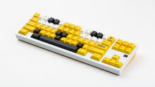 Load image into Gallery viewer, GMK CYL GREG 2 keycaps on a white TKL keyboard, wide angled view with GREG novelty keys