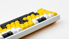 Load image into Gallery viewer, GMK CYL GREG 2 keycaps on a white TKL keyboard, left-side angled close-up