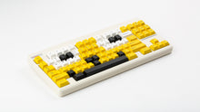 Load image into Gallery viewer, GMK CYL GREG 2 keycaps on a cream Classic TKL keyboard, wide angled view