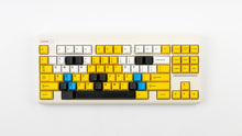 Load image into Gallery viewer, GMK CYL GREG 2 keycaps with blue accent keys on a cream Classic TKL keyboard, front view
