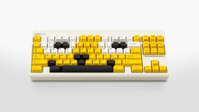 Load image into Gallery viewer, GMK CYL GREG 2 keycaps on a cream Classic TKL keyboard, three-quarter overview