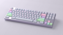 Load image into Gallery viewer, render of GMK CYL Gurokawa on a purple keyboard angled