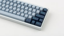 Load image into Gallery viewer, GMK CYL Hammerhead Small Batch keycaps on white 60% keyboard with teal accent stripe, close-up of right side showing navy modifiers