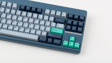 Load image into Gallery viewer, GMK CYL Hammerhead Small Batch keycaps on slate blue TKL keyboard, close-up of right side showing teal Enter and arrow cluster accents