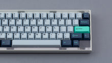 Load image into Gallery viewer, GMK CYL Hammerhead Small Batch keycaps on clear polycarbonate 65% keyboard, frontal close-up of right side with teal Enter accent
