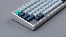 Load image into Gallery viewer, GMK CYL Hammerhead Small Batch keycaps on clear polycarbonate 65% keyboard, close-up of left side with teal Esc accent