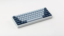 Load image into Gallery viewer, GMK CYL Hammerhead Small Batch keycaps on white 60% keyboard with teal accent stripe, three-quarter angled view