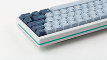 Load image into Gallery viewer, GMK CYL Hammerhead Small Batch keycaps on white 60% keyboard with teal accent stripe, close-up of rear right showing navy modifiers