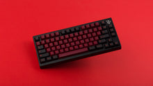 Load image into Gallery viewer, GMK CYL Infernal on a black 7V keyboard angled