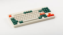 Load image into Gallery viewer, GMK CYL Kaiju R3 hiragana base keycaps on beige TKL keyboard, full board angled view