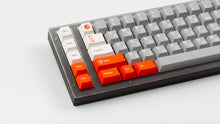 Load image into Gallery viewer, GMK CYL Mars Cadet on a grey keyboard close up on left side