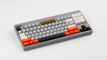 Load image into Gallery viewer, GMK CYL Mars Cadet on a regolith CLASSIC-TKL angled