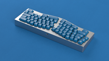 Load image into Gallery viewer, render of GMK CYL Masterpiece R2 keycaps on silver Alice keyboard, wide view