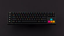 Load image into Gallery viewer, GMK CYL Mictlan on a black confetti finish keyboard 