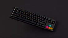 Load image into Gallery viewer, GMK CYL Mictlan on a black confetti finish keyboard angled on black background