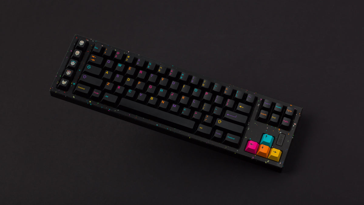  GMK CYL Mictlan on a black confetti finish keyboard angled on black background 